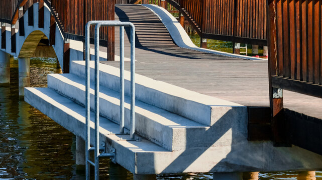 Concrete stairs leading to lake swimming area Pobiedziska, Poland
