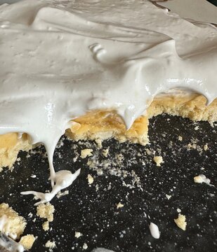 Top view of smooth white protein cream texture with soft swirls and peaks