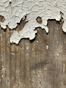 Vintage weathered wood background with cracked peeling paint and rustic texture
