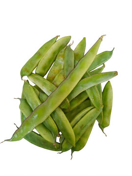 A pile of fresh green cluster beans with a slight sheen