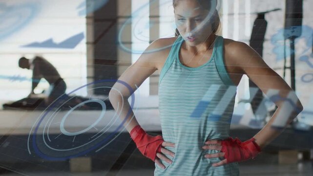Woman with red wraps breathing, raising gaze in gym while HUD sweeping over, signaling ready