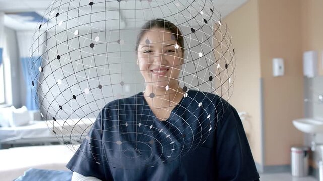 Female nurse in navy scrubs sitting, smiling, laughing in patient room with spherical grid overlay