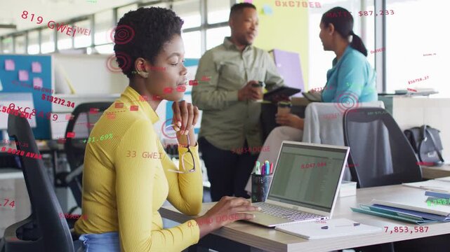 Woman in yellow top typing on laptop, sparking data overlays on sheet for business insight, smiling