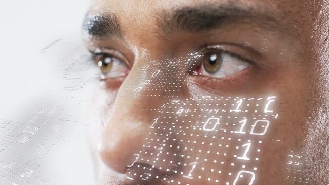 Camera zooming, man holding gaze while dotted grid and binary digits mapping face for tech demo