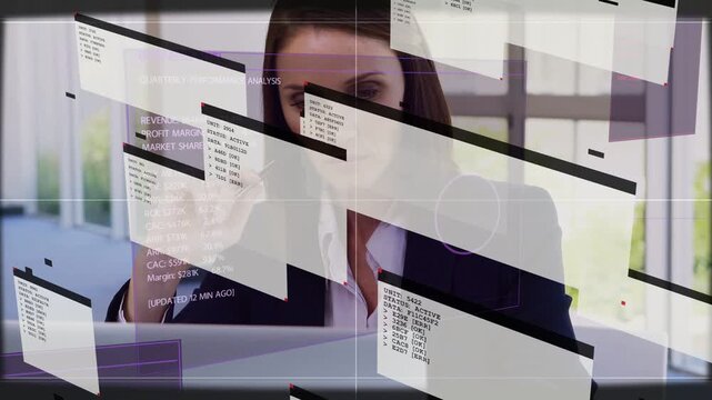 Business analyst at desk, lowering pen tapping laptop while HUD windows sliding in analyzing data