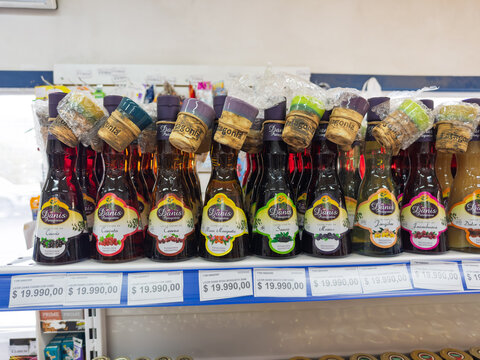 Argentina, El Chalten, March 05, 2026, Danis Patagonia, glass bottle, 0,2 l, assorted fruit liqueurs on a store shelf with price tags