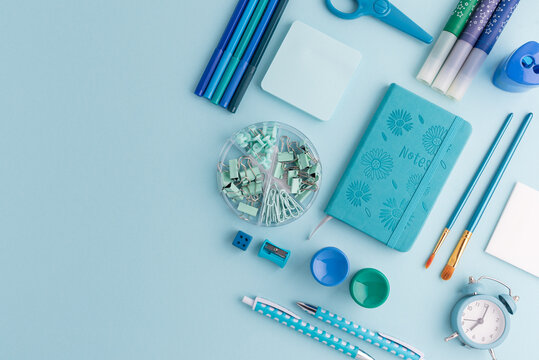 Blue and Green School Supplies Flat Lay