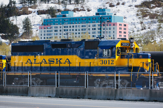 Sunlight on the Alaska Railroad train parked at a station. Seward, Alaska, May 2022
