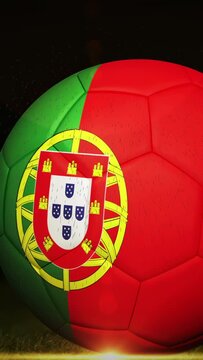 Vertical video: Portugal ball sitting turf, sneaker kick causing spin showing crest under warm glow