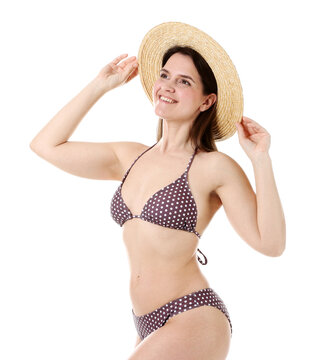 Beautiful woman wearing stylish swimsuit and hat on white background