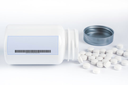 Flacon de m&eacute;dicaments. Avec cachets &eacute;parpill&eacute;s. Etiquette et code barre. Zone texte libre.