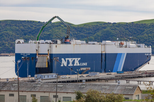 NYK Line roll‑on roll‑off cargo vessel docked at the Martinez waterfront terminal
