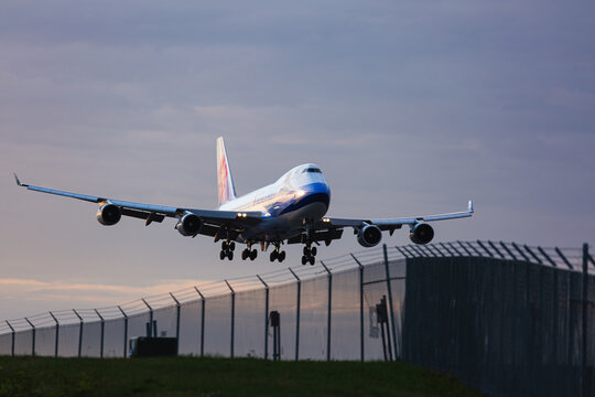 Passenger airplane arriving at Anchorage airport during sunset. Anchorage, Alaska, May 2022