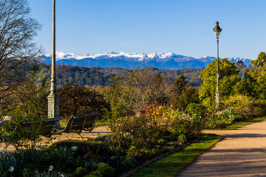 Panoramic view of the still snow-capped Pyrenees chain in spring from Parc Beaumont in Pau