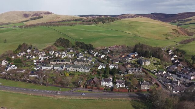 Idyllic Scottish village scenery in Eddleston with traditional cottages integrated into the natural rural landscape of the borders