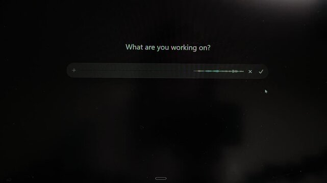 Cursor activates voice input in artificial intelligence chat on computer screen. Audio waveform reacts to spoken prompt during interaction process. Technology concept shows modern