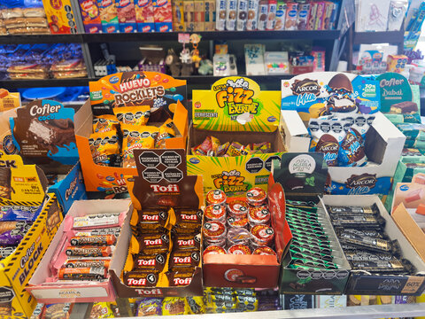 Iguazu, Brazil, March 08, 2026, Arcor and Tofi, box, chocolate bars and candies on a retail store shelf display