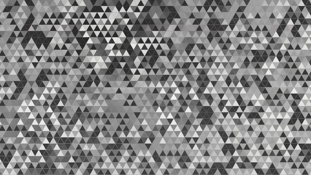 Technical loop animation of a dense geometric pattern composed of triangles in various shades of grey, black, and white. Seamless monochrome triangle pattern.