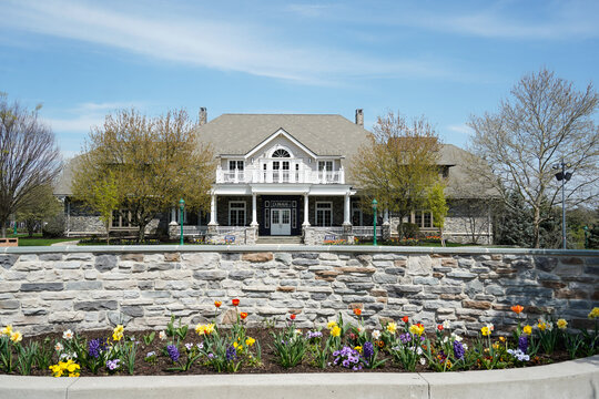 1933 Restaurant & Tavern located at the Hotel Hershey in Hershey, Pennsylvania. View from outside, spring landscaping, tulips, and retaining wall.