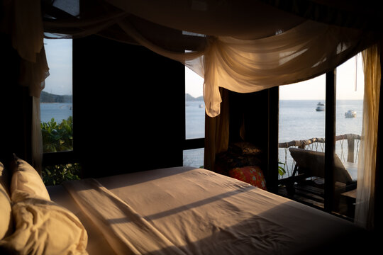 A bedroom at sunset facing the sea on the island of Ko Tao in Thailand.
