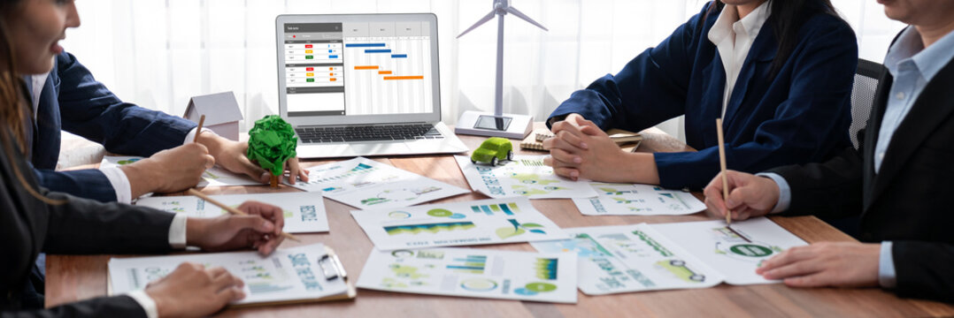 Project planning software for brisk business project management on the computer screen showing timeline chart of the team project