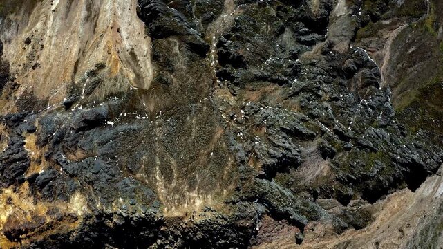 Aerial top down view of a mountain showing the many dangerous rocks 