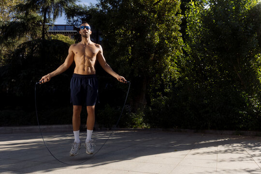 A young man is jumping rope