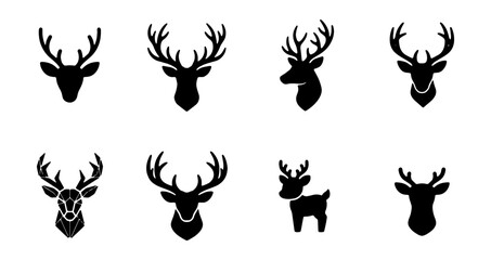 Set of deer head silhouettes and icons, vector illustrations of stag antlers and reindeer heads © Suriya