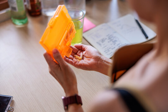 Person getting daily vitamins