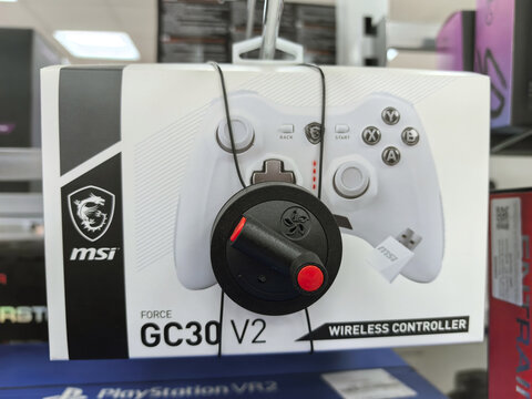 MSI Force GC30 V2 wireless controller displayed in a tech store