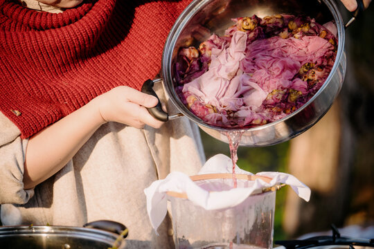 Plant-based tie-dye water poured from a pot