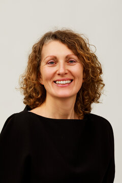 Smiling Woman With Curly Hair 