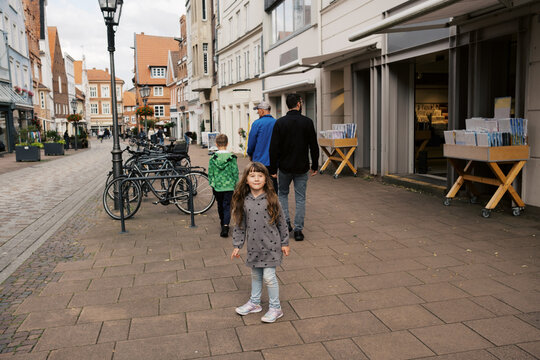 family walking through city in germany