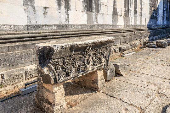 Ancient stone with ornate carvings in historic ruins