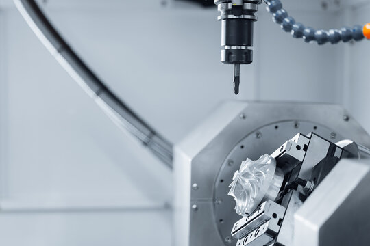 Five axis CNC machining center cutting engine turbine. Concept modern technology for industry