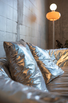 Metallic Cushions on Sofa in Minimal Loft Interior
