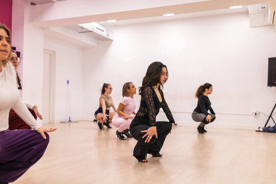 Women practicing dance in heels at the dance studio