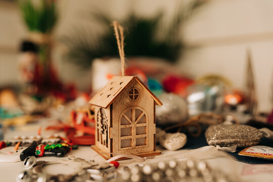 Wooden House Christmas Ornament on Festive Table
