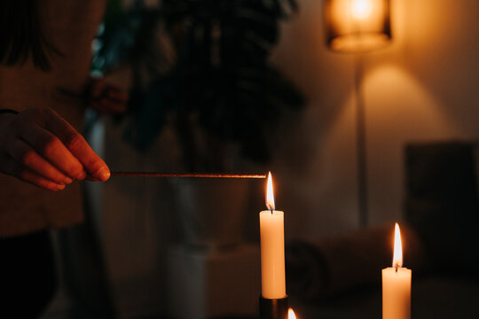 Lighting Candles for Relaxing Yoga Session