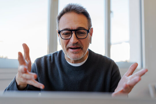 Business professional communicating during online video call