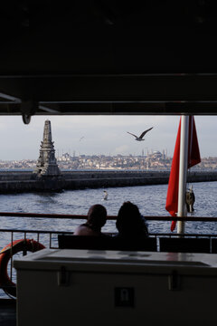 Passengers admire the view from a ferry