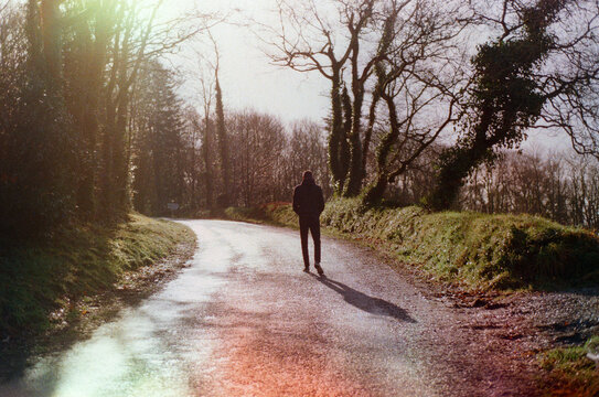 Man from the back walking in the French countryside