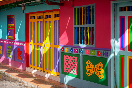 Multicolor Colonial Facade With Carved Decorative Panels