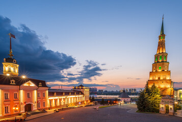 Fototapeta premium The ancient leaning red brick Syuyumbike Tower at night on the territory of the Kazan Kremlin. Russia