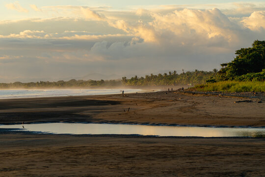 Tropical beach sunset reflecting warm evening light