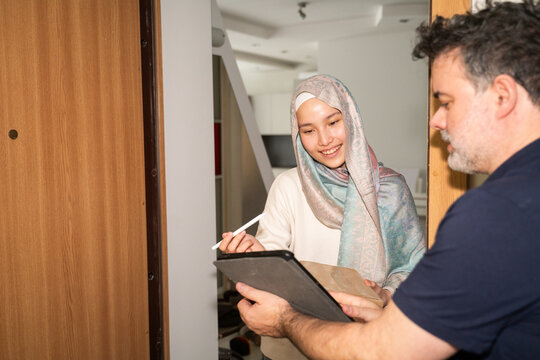 Courier Meets Muslim Customer at the Door to Complete a Service