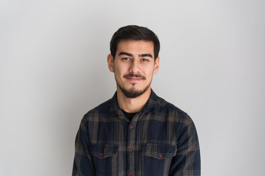 Young Man Poses for a Photo Studio