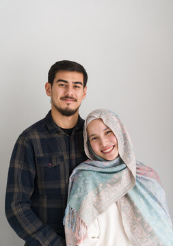 Studio Portrait Of Happy Muslim Couple
