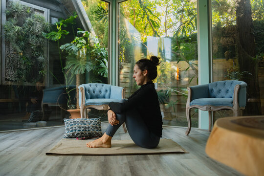 Woman Stretching On Yoga Mat