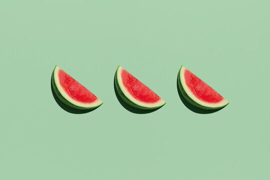 Vibrant watermelon slices on a pastel green background